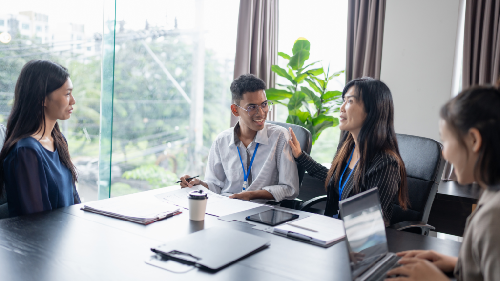 Career Reality in 2026: What Companies Actually Expect From Job Seekers a split screen showing graduates holding degrees on one side and professionals working on laptops with technical tools on the other.