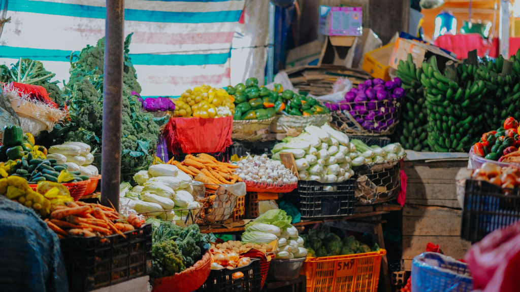 Agricultural Market Prices in 2026: Factors Affecting Crop Prices and Farmer Income a split screen showing graduates holding degrees on one side and professionals working on laptops with technical tools on the other. (27)